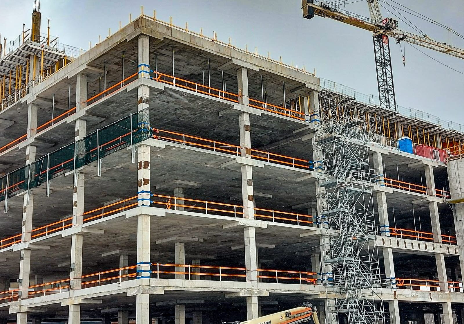 StrapRail provides fall protection for workers on multiple floors on a new concrete building.