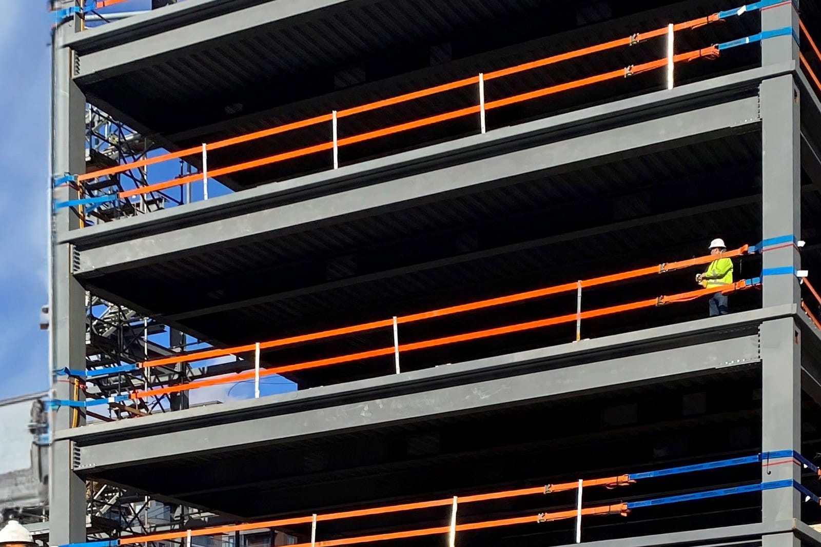 StrapRail provides fall protection for workers on multiple floors on a new steel building.